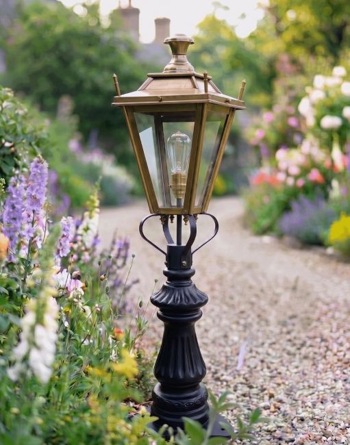 Digital Illustration of the 103cm Antique Brass Dorchester Fluted Patio & Driveway Light Positioned on a Flowery Gravel Driveway Entrance