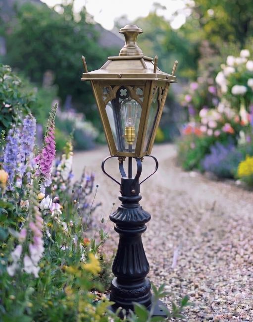 Digital Illustration of the 103cm Antique Brass Gothic Fluted Patio & Driveway Light Positioned on a Garden Gravel Entranceway
