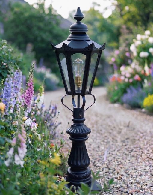 Digital Illustration of the 103cm Black Concordia Fluted Patio & Driveway Light Positioned on a Flowery Garden Drive Entrance