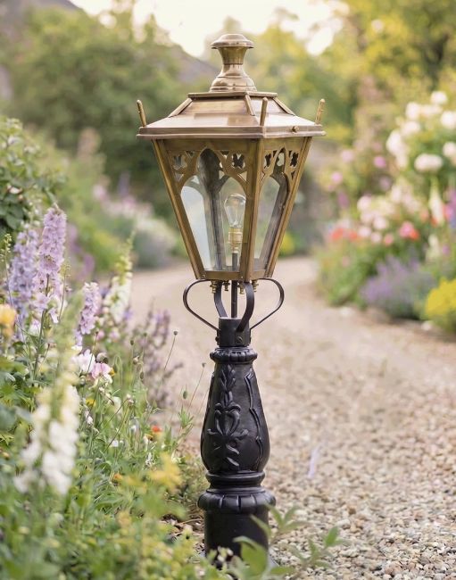 Digital Illustration of the 105cm Antique Brass Gothic Design Driveway and Patio Lighting Placed Next to a Flowery Gravel Entrance