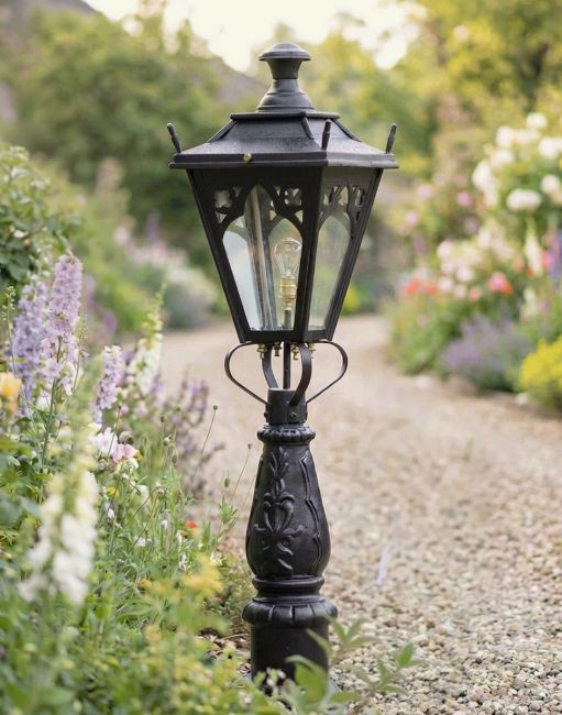 Digital Illustration of the 105cm “Gothic Design” Driveway and Patio Lighting Placed on a Flowery Gravel Driveway