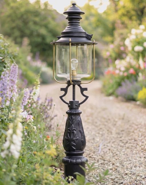 Digital Illustration of the 112cm Belgravia Driveway Light Positioned on a Flowery Gravel Entranceway