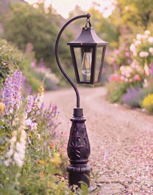 Digital Illustration of the 112cm Black “Lincoln” Swan Neck Lantern & Lamp Post Placed next to a Flowery Gravel Driveway Entrance