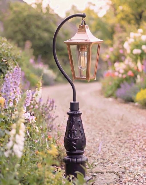 Digital Illustration of the 112cm Copper “Lincoln” Swan Neck Lantern & Lamp Post Positioned on a Flowery Gravel Driveway Entrance