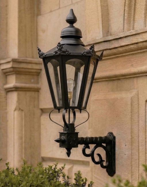 Digital Illustration of the 115 x 53cm Black Concordia Hexagonal Lantern on a Royale Bracket Mounted on an Ornate Sandstone Brick Wall