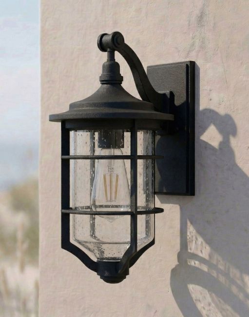 Digital Illustration of the "Marine" Nautical Hanging Wall Light Lit up Mounted on a Sunny White Coloured Garden Wall