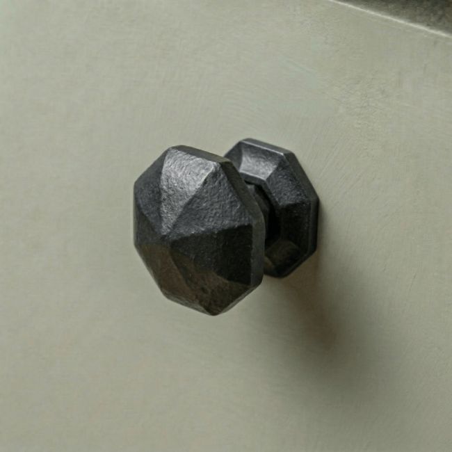 Digital Illustration of the 32mm Steel Beeswax Octagonal Cabinet Knob on a Sage Green Cupboard Door