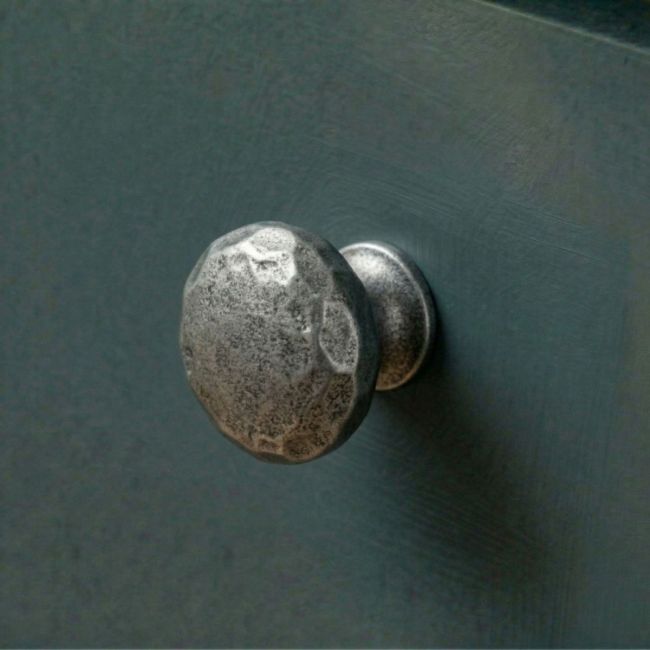 Digital Illustration of the 33mm Hammered Cast Iron Cabinet Knob Mounted on a Dark Blue Cupboard Door Digital Illustration of the 33mm Hammered Cast Iron Cabinet Knob Mounted on a Dark Blue Cupboard Door