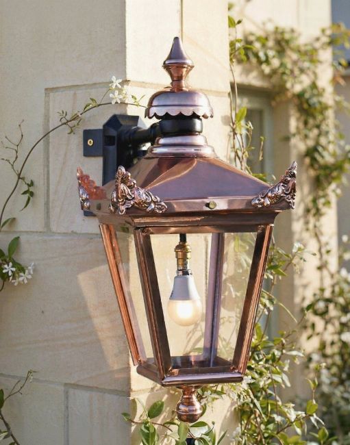 Digital Illustration of the 61 x 46cm Standard Copper Hanging Corner Wall Lantern Mounted on a Limestone Brick Building Wall