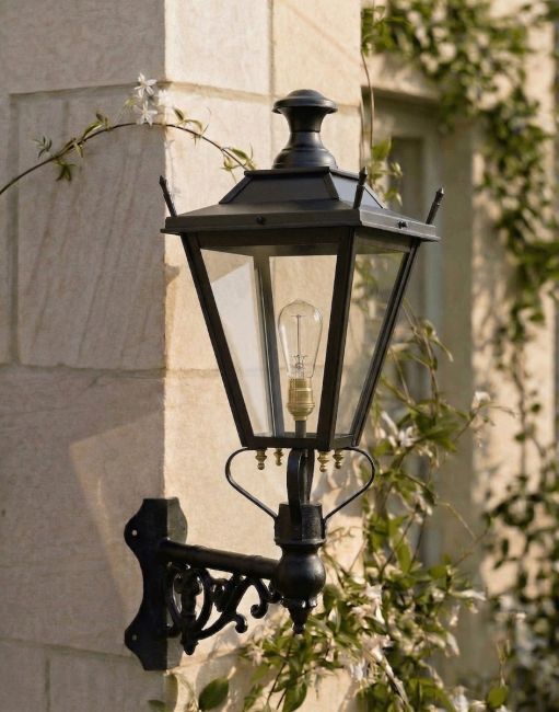 Digital Illustration of the 84 x 37cm Black Dorchester Wall Lantern on a Corner Bracket Mounted on a Sandstone Brick Cottage Wall