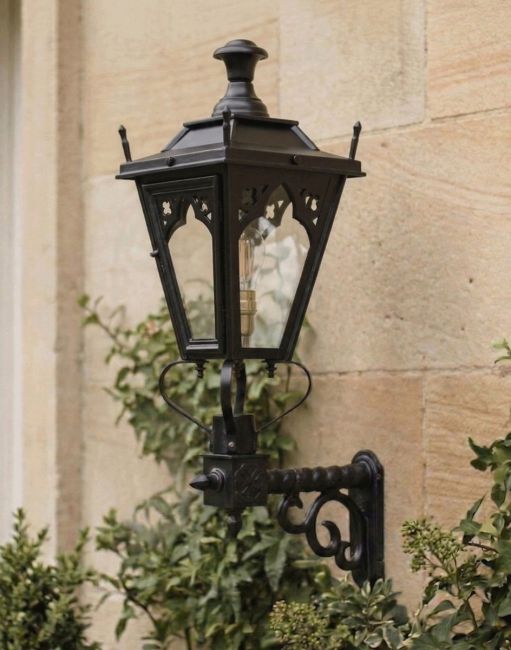 Digital Illustration of the 84 x 37cm Black Gothic Wall Lantern on a Royale Bracket Mounted on a Classic Sandstone Brick Building 