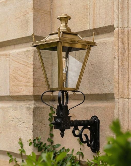 Digital Illustration of the 84 x 37cm Brass Dorchester Wall Lantern on a Royale Bracket Mounted on a Sandstone Brick Property