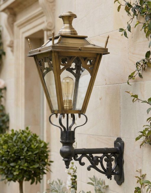 Digital Illustration of the 84 x 37cm Brass Gothic Wall Lantern on Ornate Bracket Mounted on a Sandstone Brick Home 