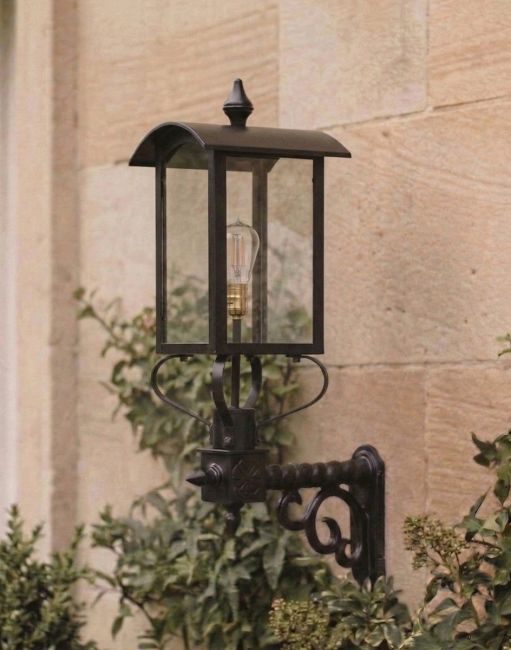 Digital Illustration of the 85 x 65cm Black Curved Top Victorian Porch Wall Light Mounted on a Sandstone Brick Building Wall