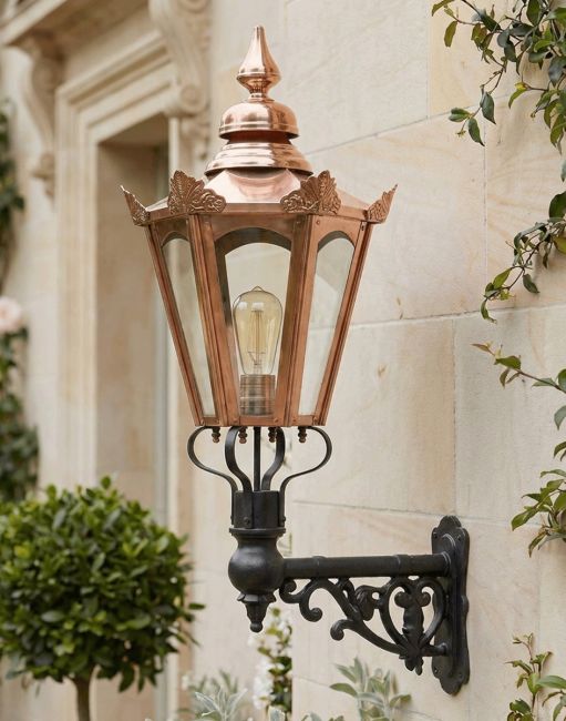Digital Illustration of the 88 x 33cm Copper Hexagonal Wall Lantern on an Ornate Bracket Mounted on a Traditional Home Entranceway
