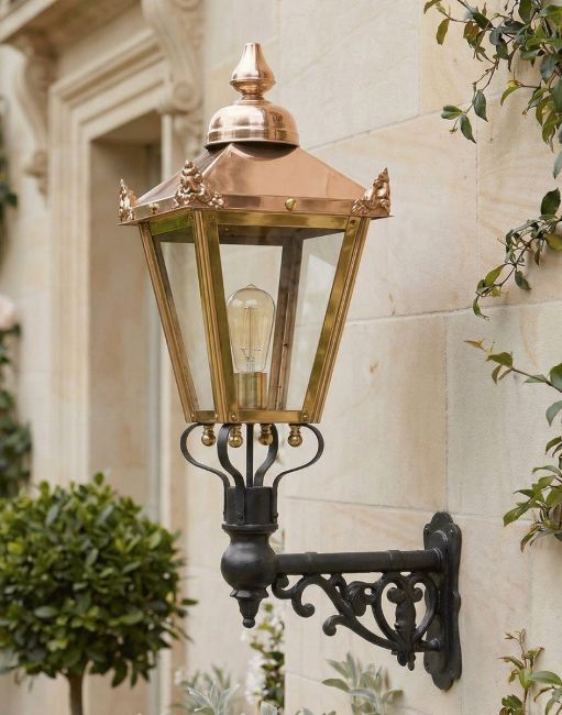 Digital Illustration of the 88 x 33cm Copper Wall Lantern on an Ornate Bracket Mounted on a Sandstone Brick Garden Wall