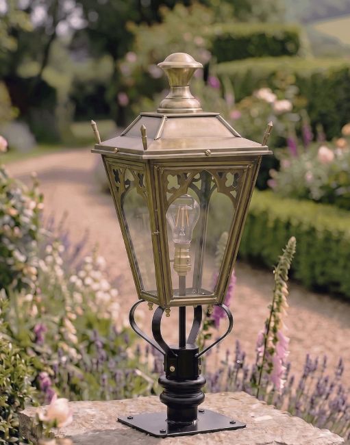 Digital Illustration of the 90cm Brass Gothic Pillar Light and Lantern Set Positioned next to a Flowery Gravel Driveway