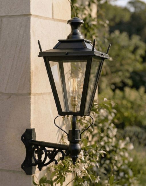 Digital Illustration of the 95 x 48cm Black Dorchester Lantern on a Corner Bracket Mounted on a Sandstone Brick Sunny Garden Wall