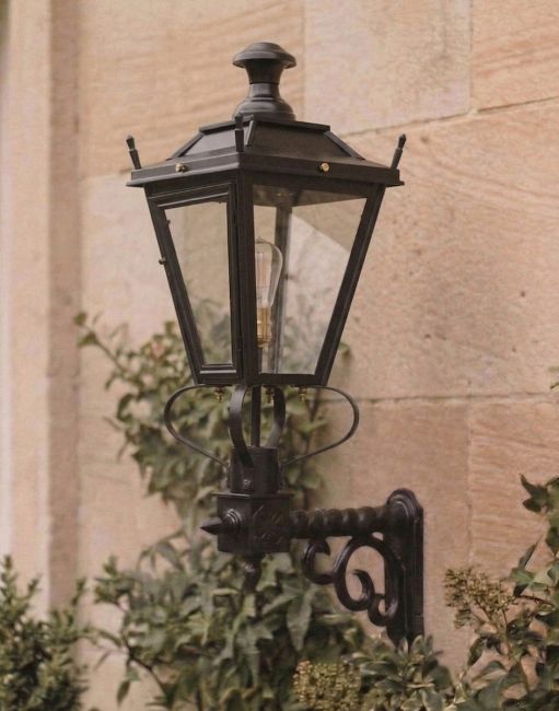 Digital Illustration of the 95 x 48cm Black Dorchester Lantern on a Royale Bracket Mounted onna Traditional Sandstone Brick Building 