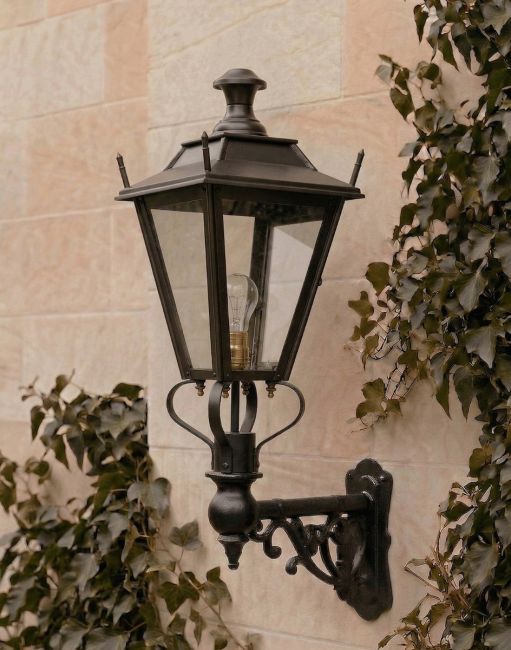 Digital Illustration of the 95 x 48cm Black Dorchester Lantern on an Ornate Bracket Mounted on an Ivy Covered Sandstone Garden Wall