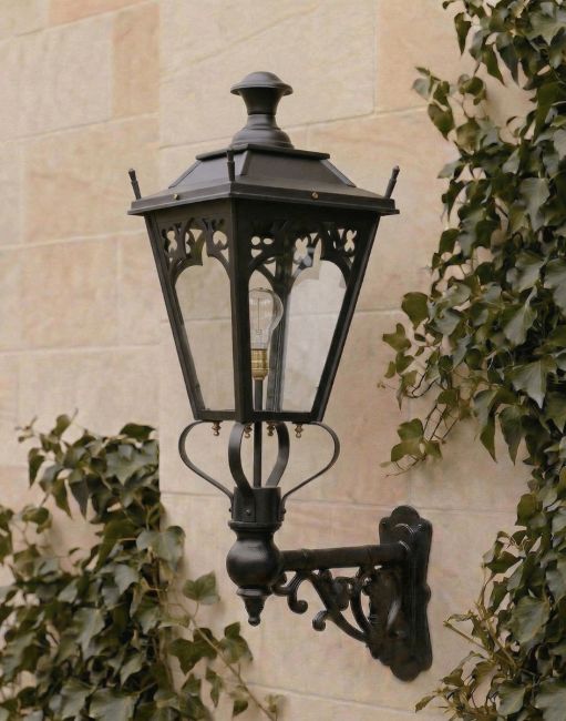 Digital Illustration of the 95 x 48cm Black Gothic Wall Lantern on an Ornate Bracket Mounted on a Sandstone Brick Garden Wall