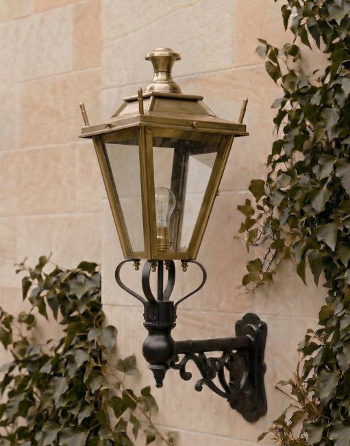 Digital Illustration of the 95 x 48cm Brass Dorchester Lantern on an Ornate Bracket Mounted on a Sandstone Brick Garden Wall