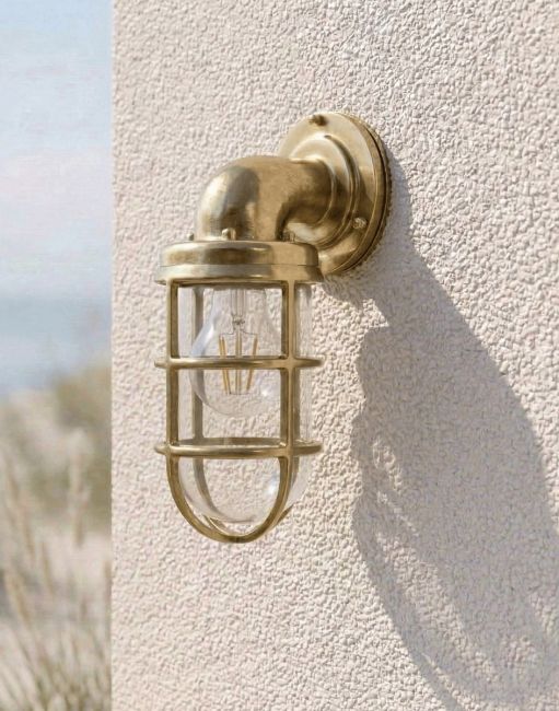 Digital Illustration of the Antique Brass Nautical "Crew" Wall Light Mounted on a Whiter Coloured Coastal Building