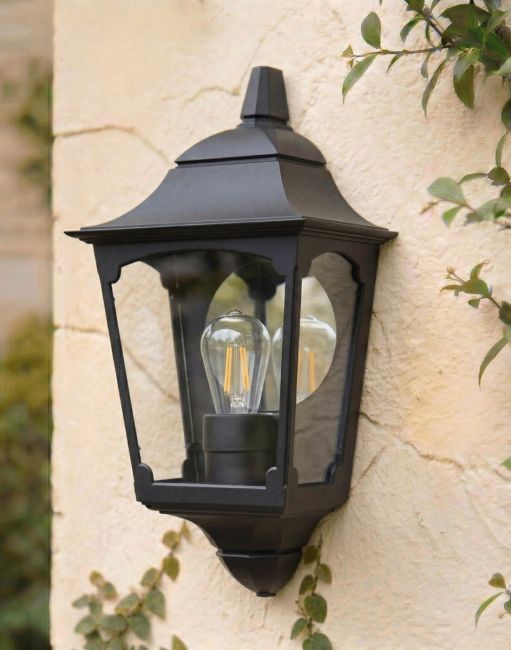 Digital Illustration of the Black "Tattershall" Half Wall Lantern Mounted on a Rustic Cream Coloured Building