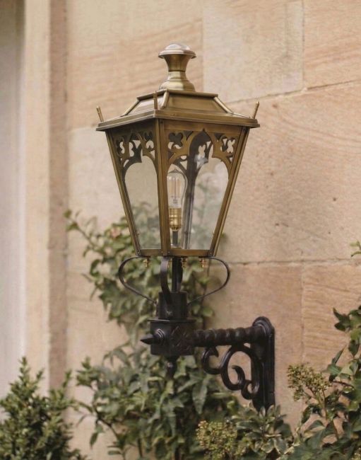 Digital Illustration of the Brass 95 x 48cm Gothic Wall Lantern on a Royale Bracket Mounted on a Sandstone Brick House Entranceway