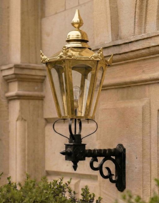 Digital Illustration of the Large Concordia Hexagonal Brass Lantern With Royale Bracket. Mounted on an Estate Building Wall