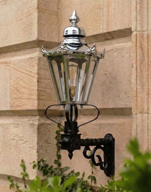Digital Illustration of the Polished Nickel Standard Concordia Hexagonal Lantern On a Royale Bracket Mounted on a Sandstone Brick House Entranceway