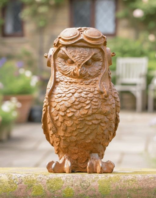 Digital Illustration of the Rustic Cast Iron "Pilot Owl" Garden Sculpture Placed in Front of a Countryside Cottage Digital Illustration of the Rustic Cast Iron "Pilot Owl" Garden Sculpture Placed in Front of a Countryside Cottage