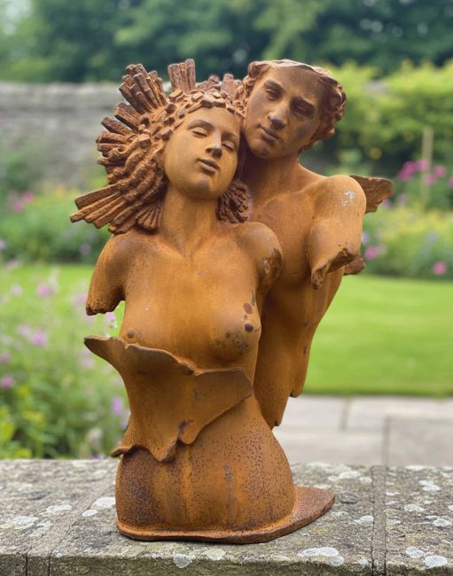 Digital Illustration of the Rustic Cast Iron "Eternal Embrace" Sculpture on a Garden Wall in a Rustic Walled Garden