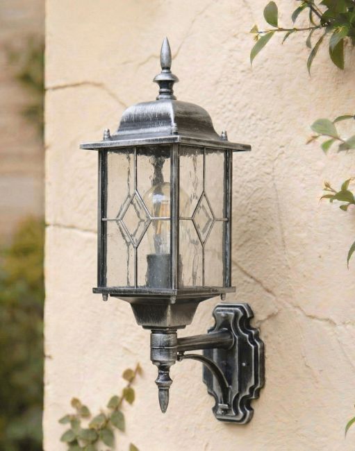 Digital Illustration of the Silver "Marsden" Wall Lantern Mounted on a Rustic White Garden Wall