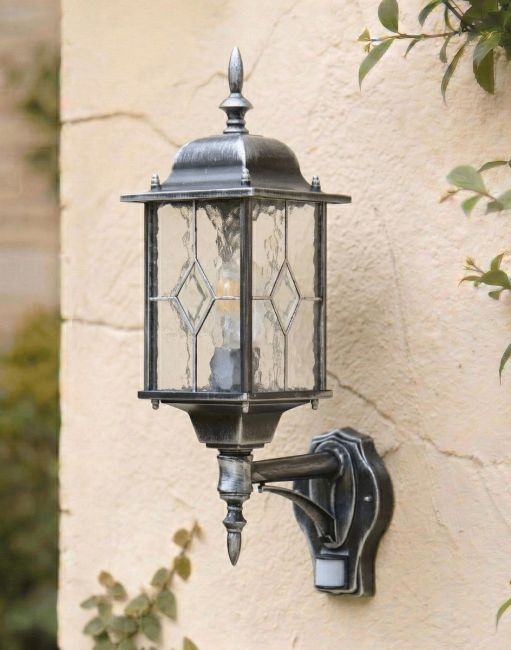 Digital Illustration of the Silver "Marsden" Wall Lantern with Built in PIR Sensor Mounted on a White Coloured Exterior Wallpg