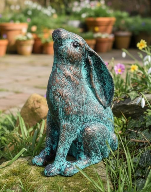 Digital illustration of a Verdigris Stargazing Rabbit Cast Aluminium Garden Sculpture in a Sunny Garden