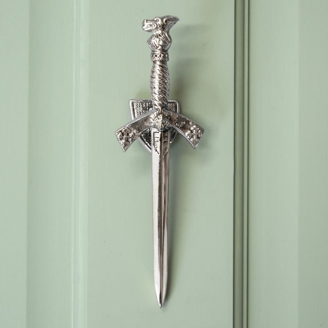 Bright Chrome Sword Door knocker on Pastel green door