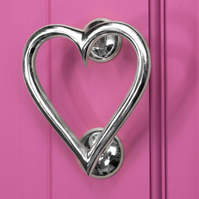 Bright Chrome Heart door knocker on Pink door Bright Chrome Heart door knocker on Pink door