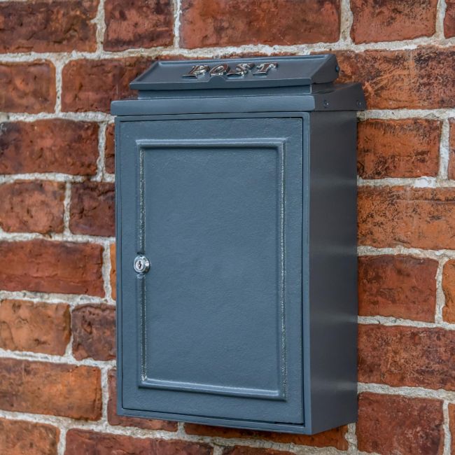 Simplistic Grey Post Box on House Wall Simplistic Grey Post Box on House Wall