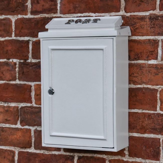 Simplistic post box on house wall Simplistic post box on house wall