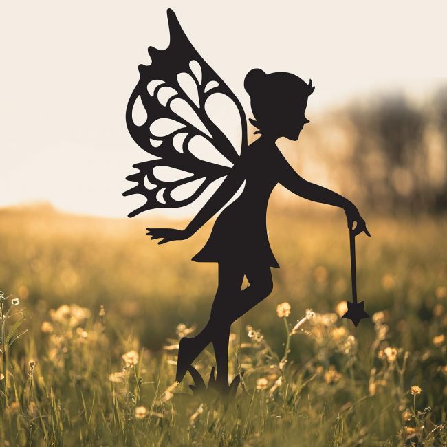 Fairy With Wand Silhouette on Display in a Field Fairy With Wand Silhouette on Display in a Field