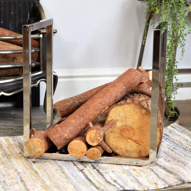 "Kresling Hall" Stainless Steel Log Holder in Stu Next to the Fireplace "Kresling Hall" Stainless Steel Log Holder in Stu Next to the Fireplace