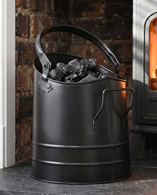 The Modern Black Coal Bucket Placed on a Carpet in Front of a Lob Burner Stove - Digital Illustration The Modern Black Coal Bucket Placed on a Carpet in Front of a Lob Burner Stove - Digital Illustration