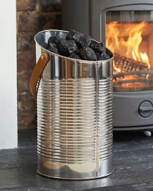 The "Mckinley Lodge" Angled Stainless Log and Coal Hod Displayed on a Fire place in a Modern Home - Digital Illustration The "Mckinley Lodge" Angled Stainless Log and Coal Hod Displayed on a Fire place in a Modern Home - Digital Illustration