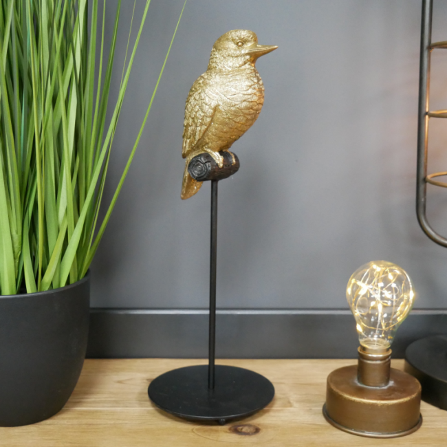 Gold Bird on Stand in Situ in the Home Gold Bird on Stand in Situ in the Home