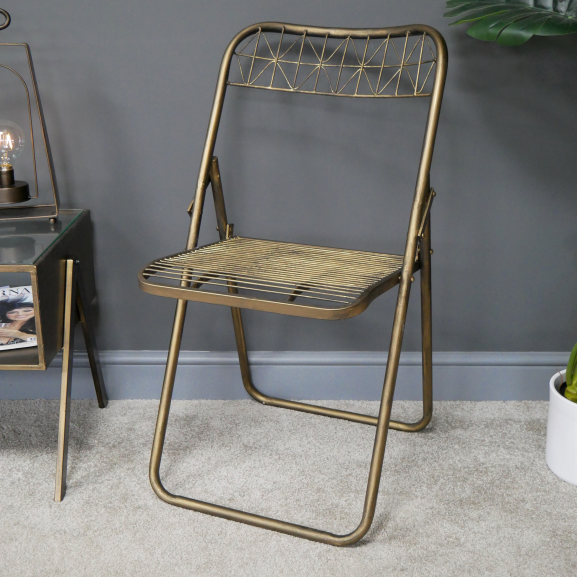 Gold Metal Wire Folding Chair in Situ Gold Metal Wire Folding Chair in Situ