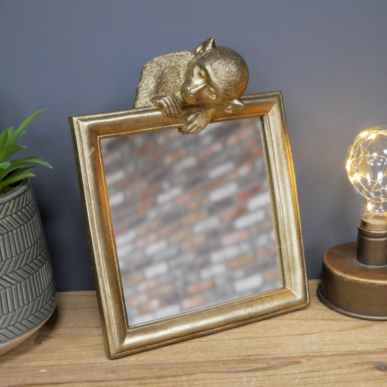 Gold Painted Monkey Mirror in Situ on a Cabinet Gold Painted Monkey Mirror in Situ on a Cabinet
