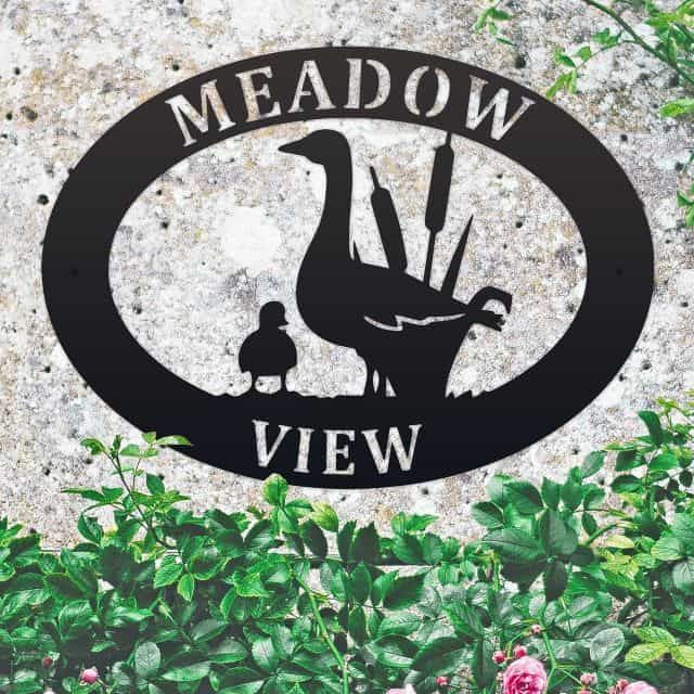 Goose & Gosling Iron Oval House Sign in situ in a Stone Wall