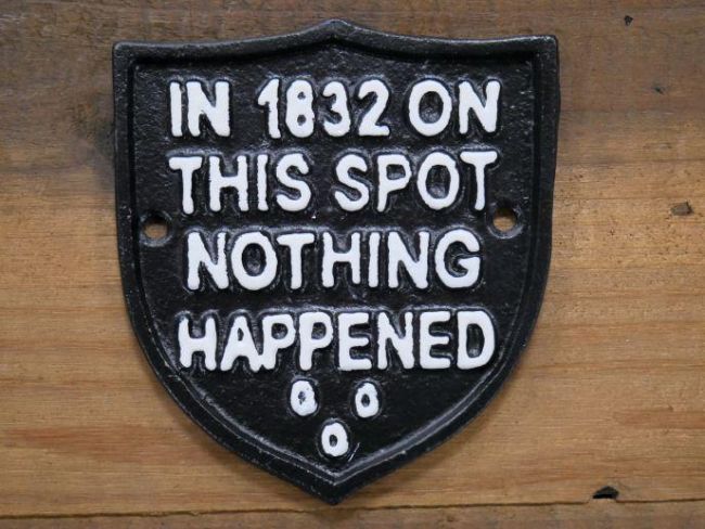 Humorous Emblem Shaped Sign in Black Iron Humorous Emblem Shaped Sign in Black Iron