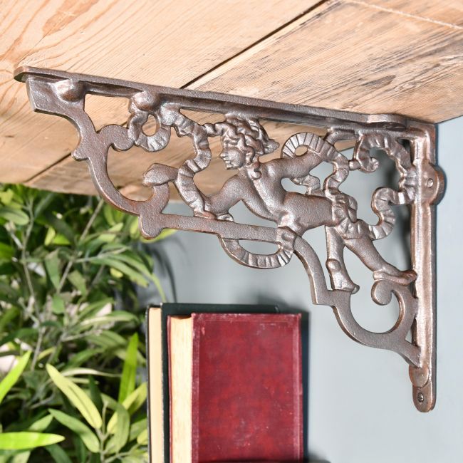 Ornate Cherub Shelf Bracket Created From Iron